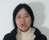 Gđa Liu Yongying nakon što je izdržala dvije godine teško zlostavljanje 