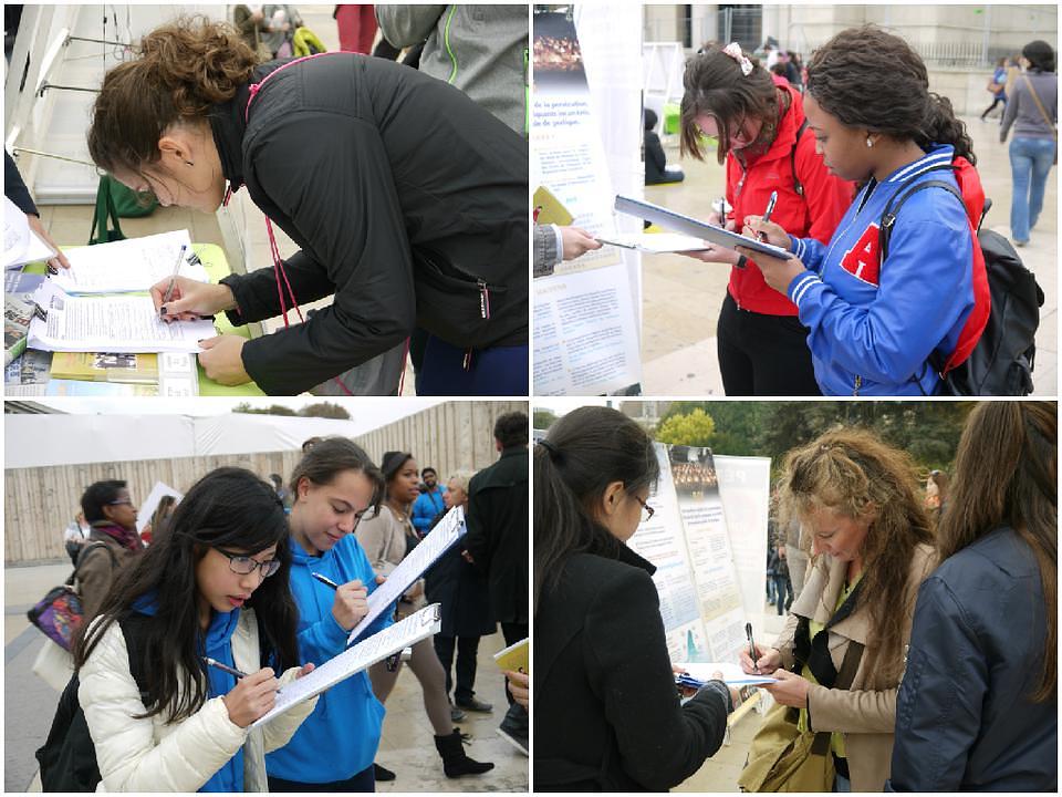 Turisti iz cijelog svijeta i lokalno stanovništvo potpisuju peticiju kojom se osuđuje progon Falun Gonga u Kini.