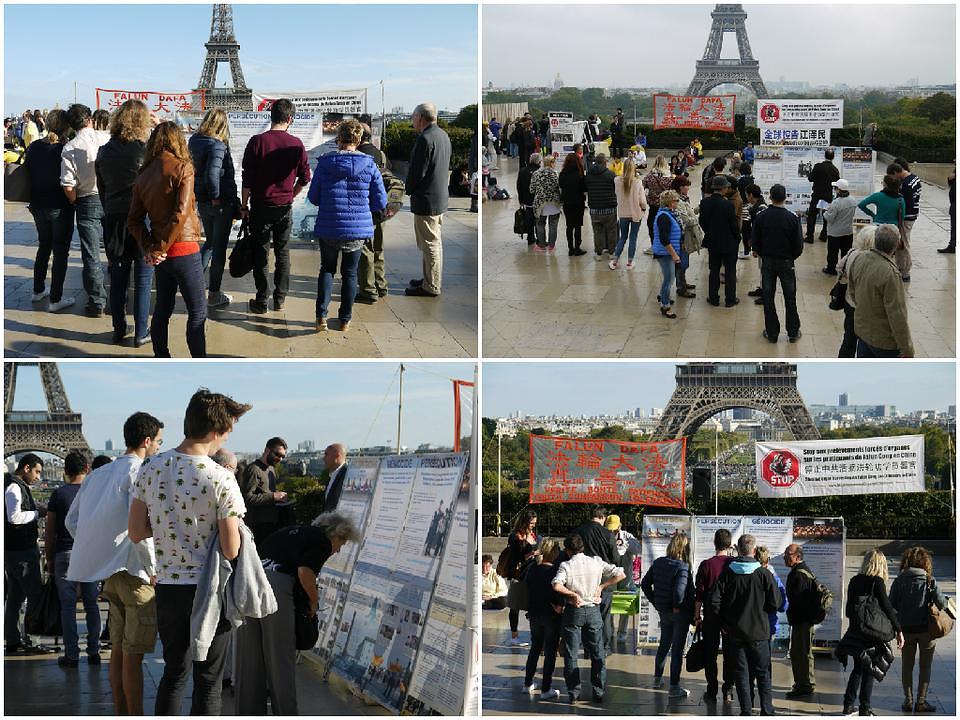 Turisti na Ajfelovom tornju čitaju o progonu Falun Gonga.