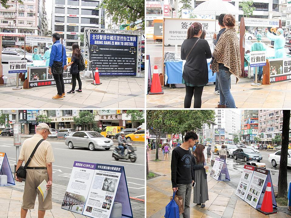 Prolaznici čitaju plakate o Falun Gongu i njegovom progonu.