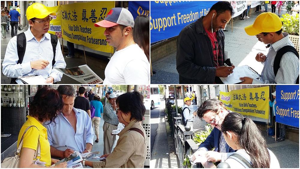 Prolaznici potpisuju poštanske dopisnice tražeći da premijera Australije da izrazi svoju zabrinutost zbog progona Falun Gonga za vrijeme posjeta Kini 